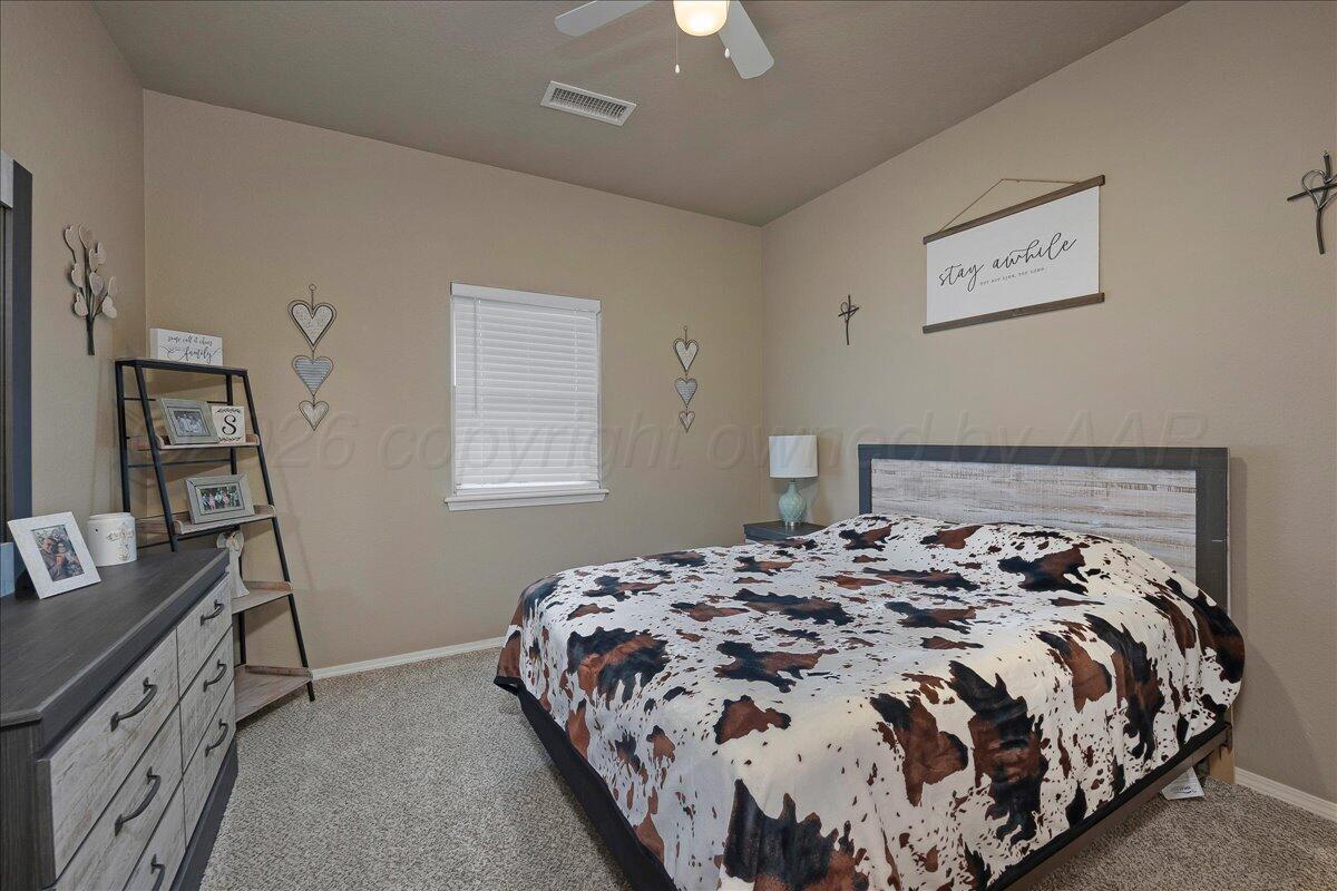 4801 Cedar Springs Trail Amarillo, TX 79119 - Photo 19 of 41 a bedroom with a bed and a window