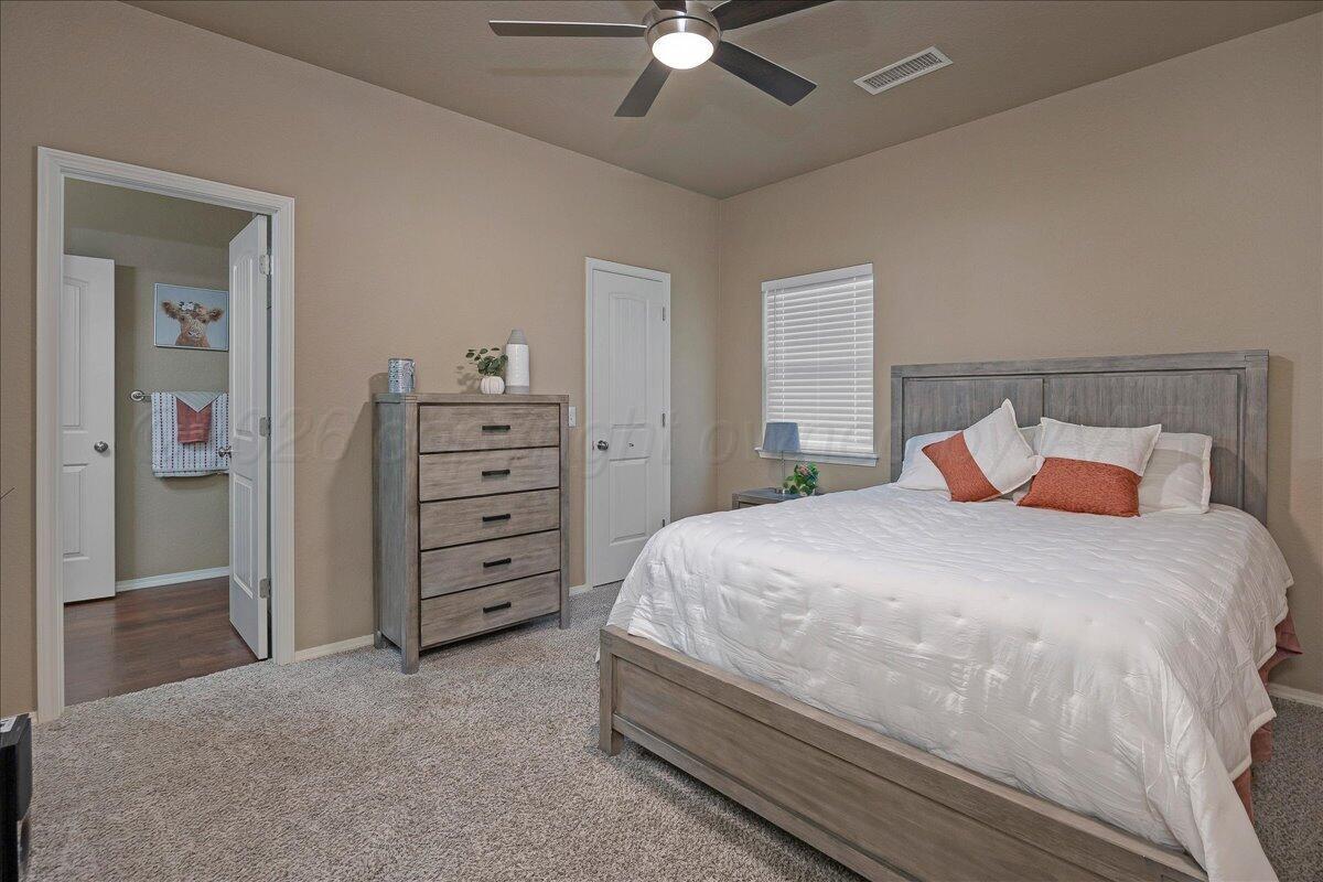4801 Cedar Springs Trail Amarillo, TX 79119 - Photo 20 of 41 a bedroom with a bed and a ceiling fan