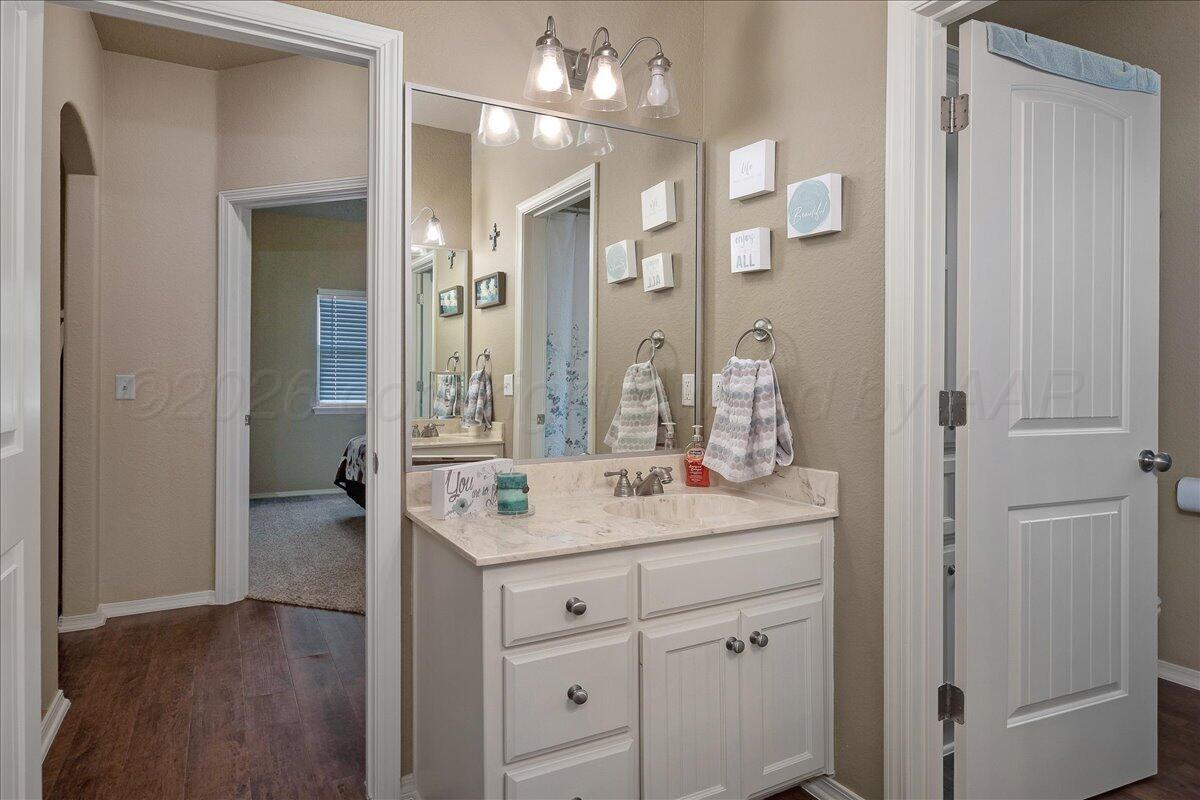 4801 Cedar Springs Trail Amarillo, TX 79119 - Photo 22 of 41 a bathroom with a double vanity sink and mirror with shower