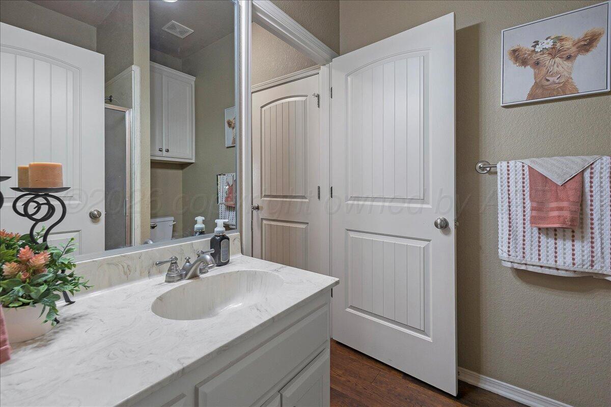 4801 Cedar Springs Trail Amarillo, TX 79119 - Photo 24 of 41 a bathroom with a sink and a mirror
