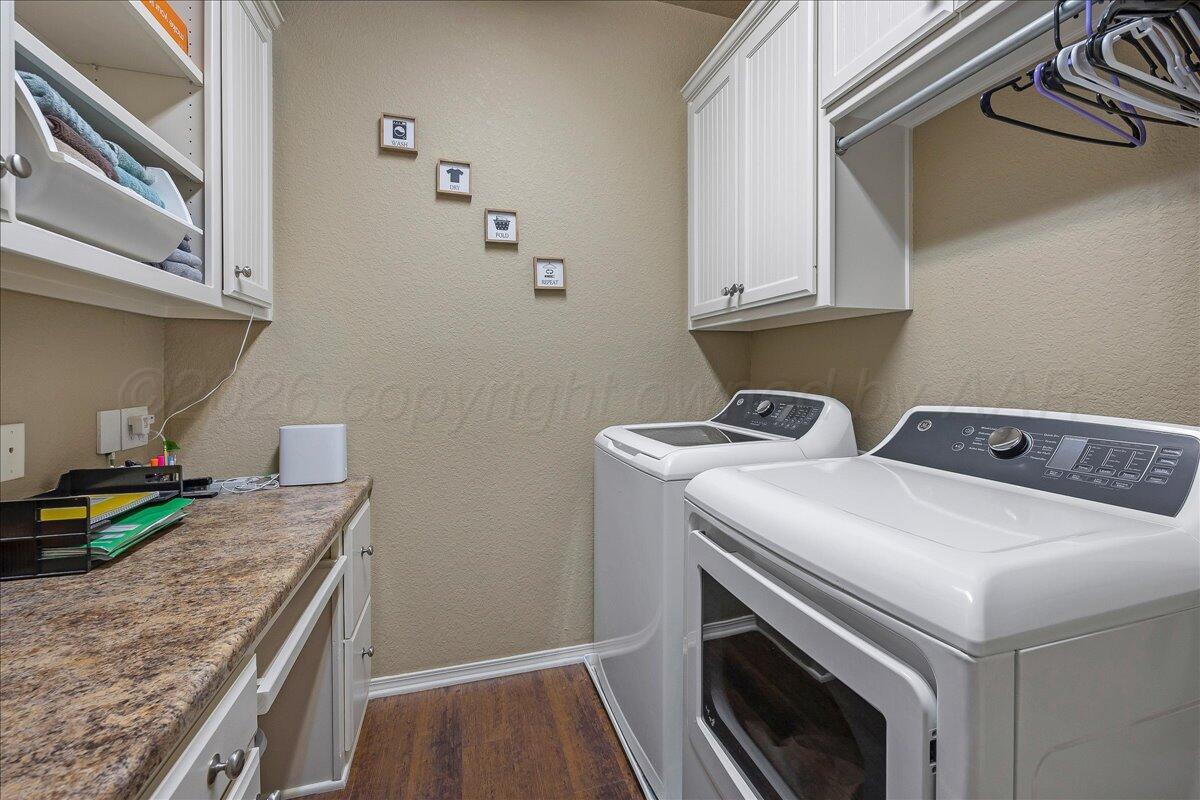 4801 Cedar Springs Trail Amarillo, TX 79119 - Photo 26 of 41 a utility room with dryer and washer