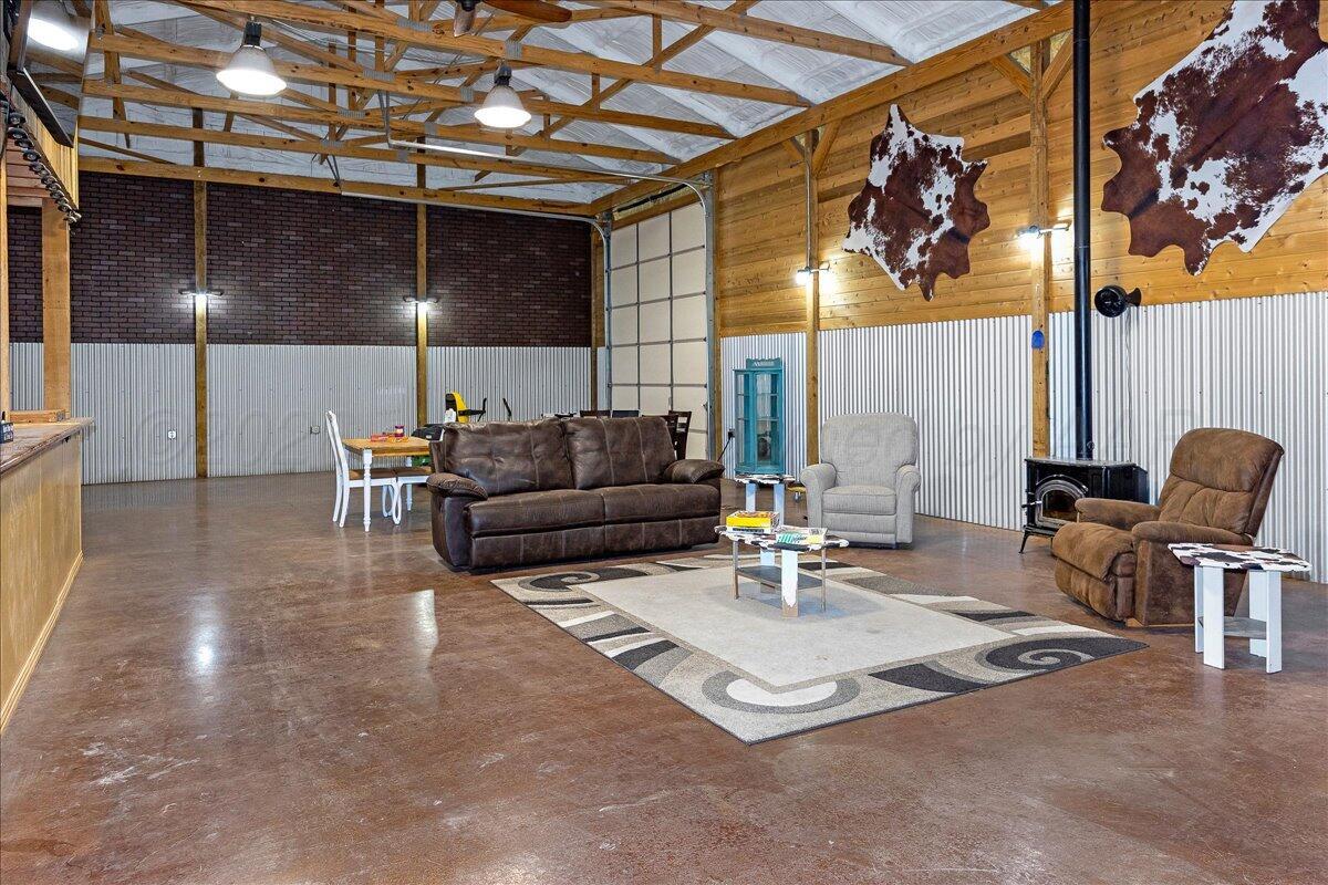4801 Cedar Springs Trail Amarillo, TX 79119 - Photo 34 of 41 a outdoor space with patio couches and a potted plant on the wall