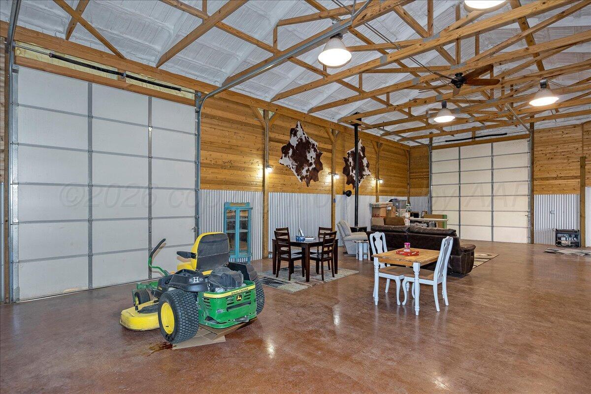 4801 Cedar Springs Trail Amarillo, TX 79119 - Photo 36 of 41 a dining room with furniture and a chandelier