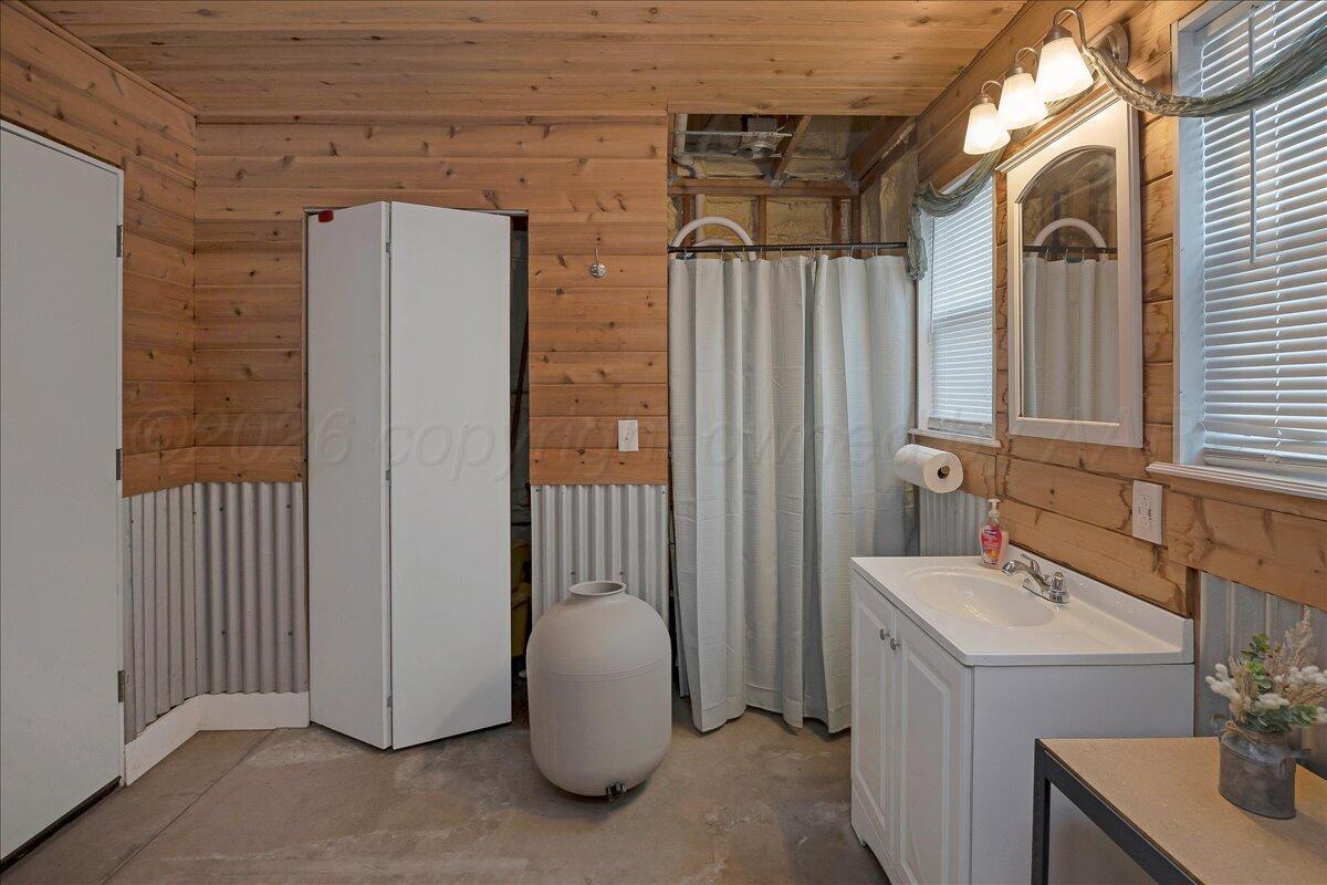4801 Cedar Springs Trail Amarillo, TX 79119 - Photo 38 of 41 a bathroom with a sink and a mirror