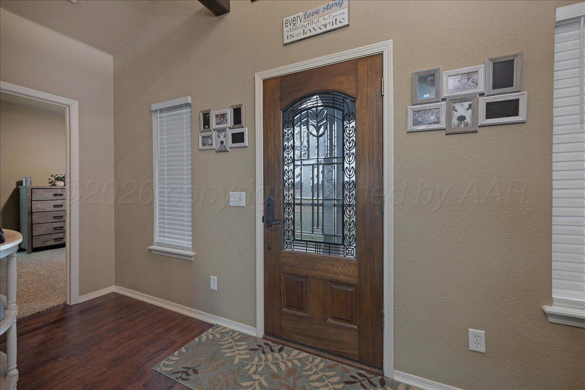 4801 Cedar Springs Trail Amarillo, TX 79119 - Photo 4 of 41 a view of an entryway with wooden floor