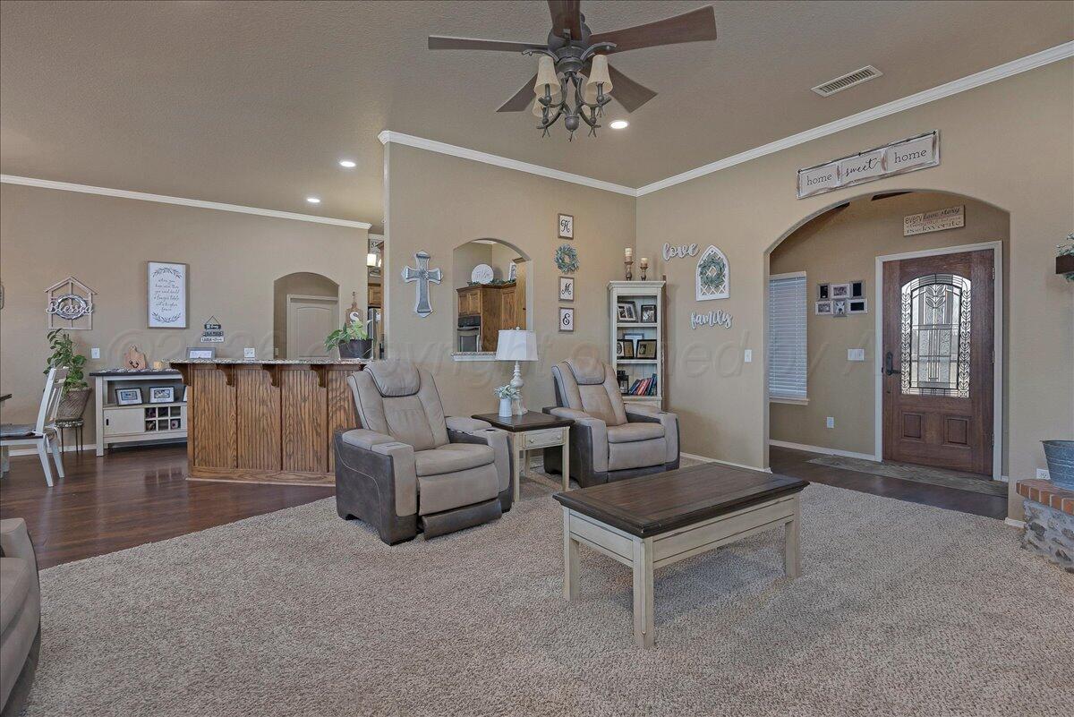 4801 Cedar Springs Trail Amarillo, TX 79119 - Photo 6 of 41 a living room with furniture and wooden floor