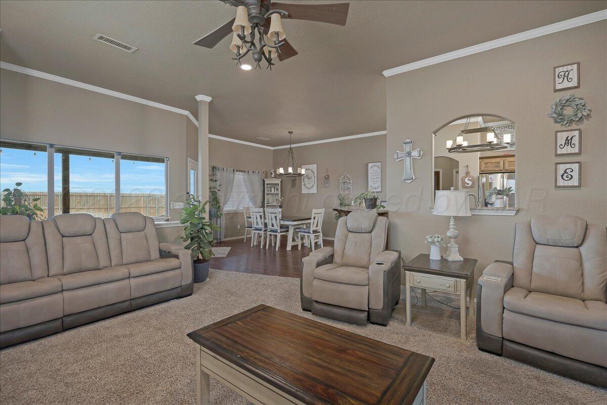 4801 Cedar Springs Trail Amarillo, TX 79119 - Photo 8 of 41 a living room with furniture and a large window