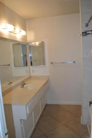 a bathroom with a sink and mirror
