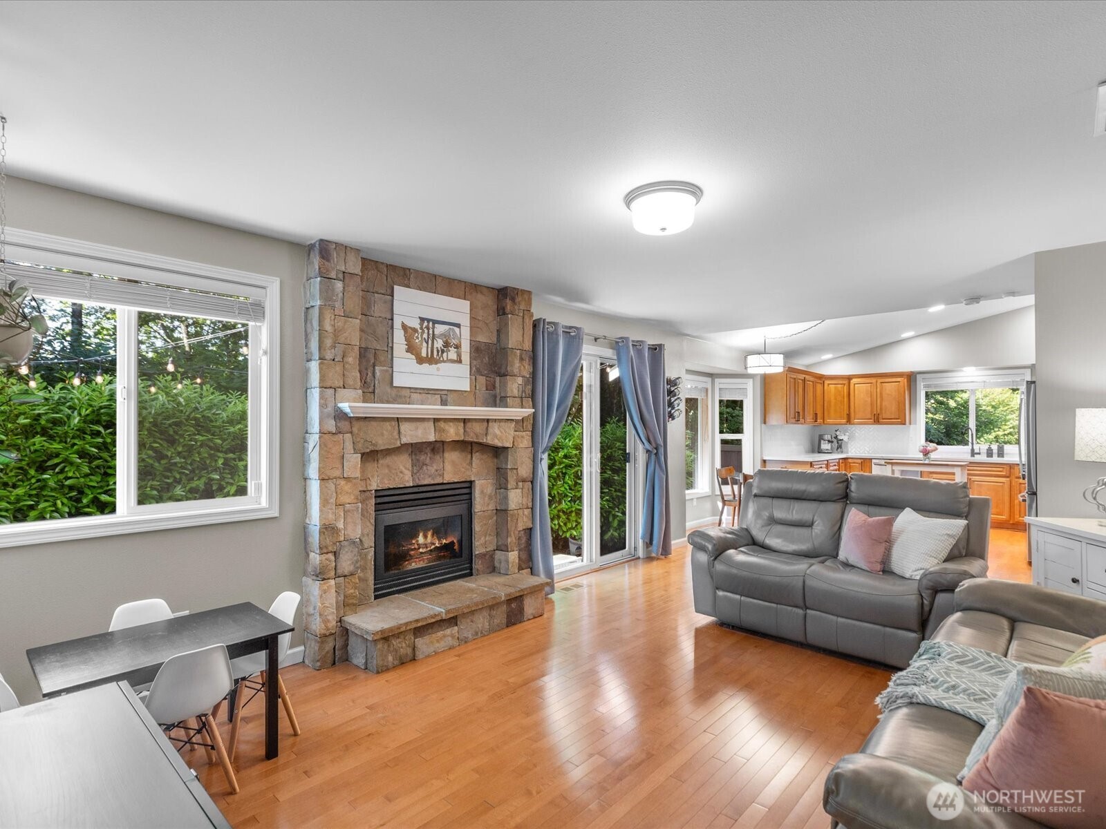 3218 189th Street Southeast Bothell, WA 98012 - Photo 14 of 40 a living room with furniture and a fireplace