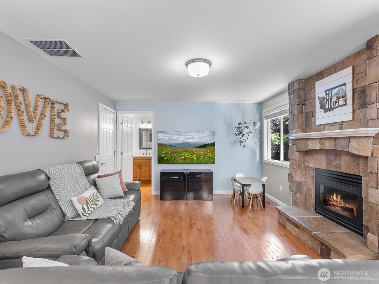 3218 189th Street Southeast Bothell, WA 98012 - Photo 15 of 40 a living room with furniture and a fireplace