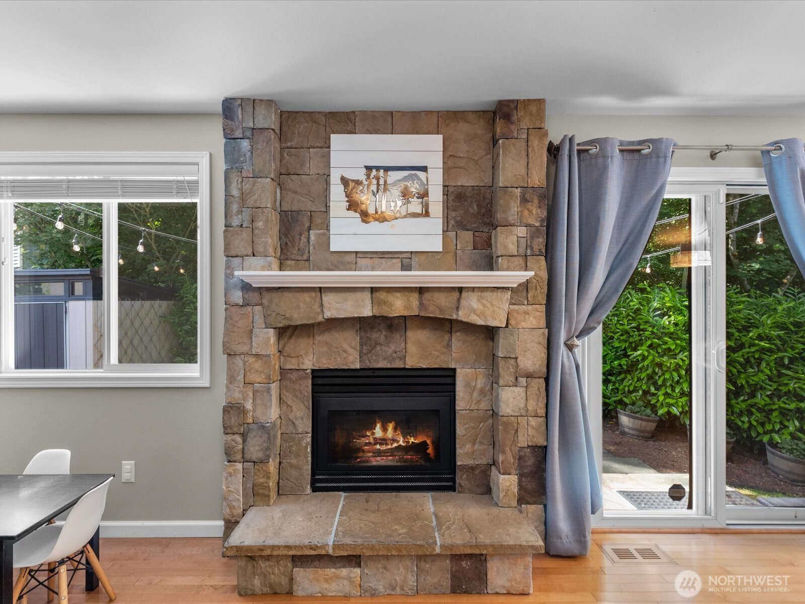 3218 189th Street Southeast Bothell, WA 98012 - Photo 16 of 40 a living room with furniture and a fireplace