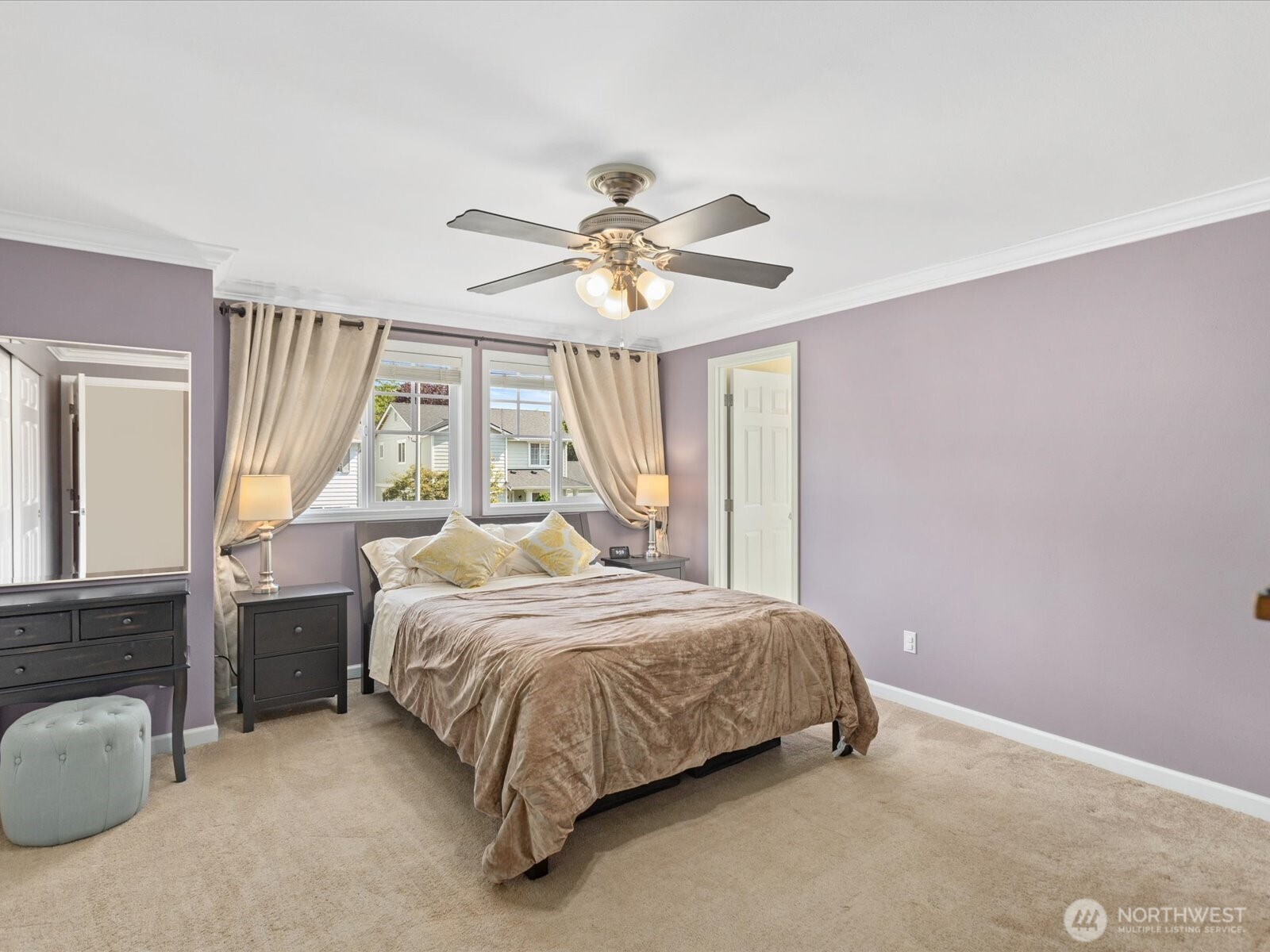 3218 189th Street Southeast Bothell, WA 98012 - Photo 19 of 40 a bedroom with a bed and a chandelier