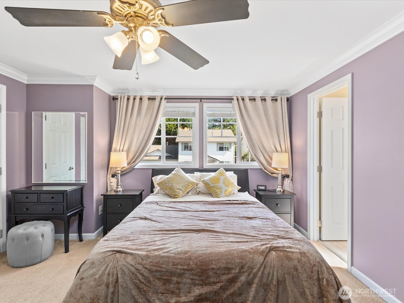 3218 189th Street Southeast Bothell, WA 98012 - Photo 20 of 40 a bedroom with a bed and a chandelier