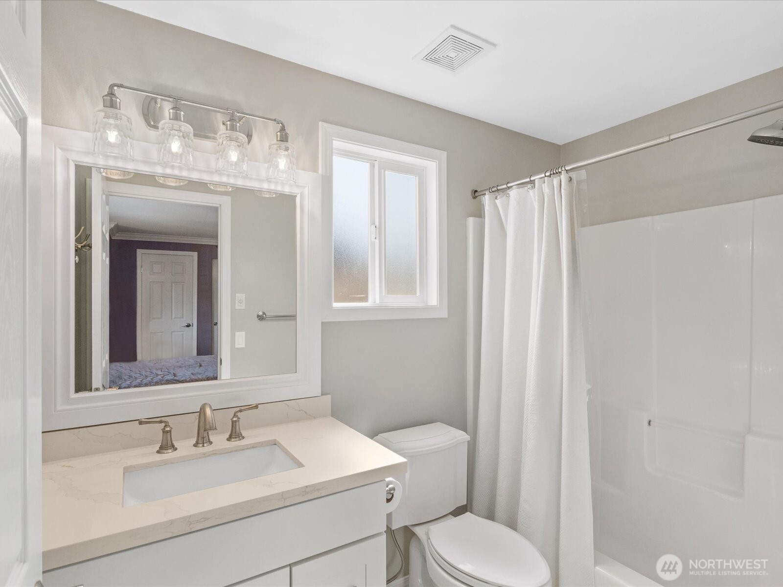3218 189th Street Southeast Bothell, WA 98012 - Photo 22 of 40 a bathroom with a sink a toilet and mirror