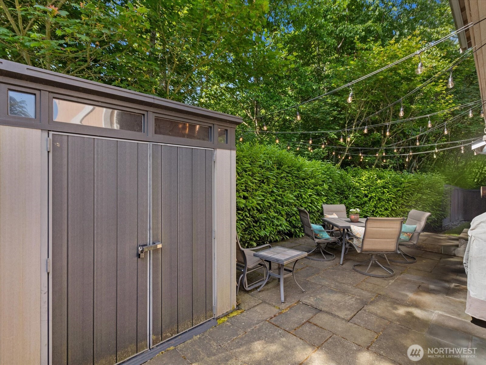 3218 189th Street Southeast Bothell, WA 98012 - Photo 30 of 40 a backyard of a house with table and chairs