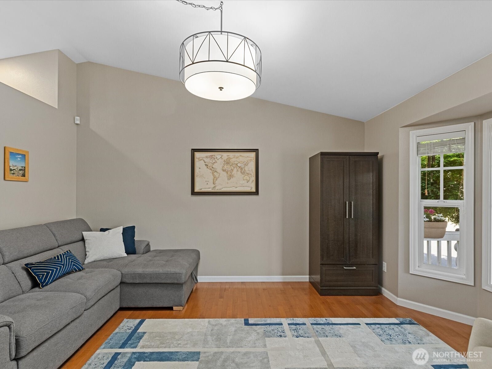 3218 189th Street Southeast Bothell, WA 98012 - Photo 8 of 40 a living room with furniture a window and a dining table