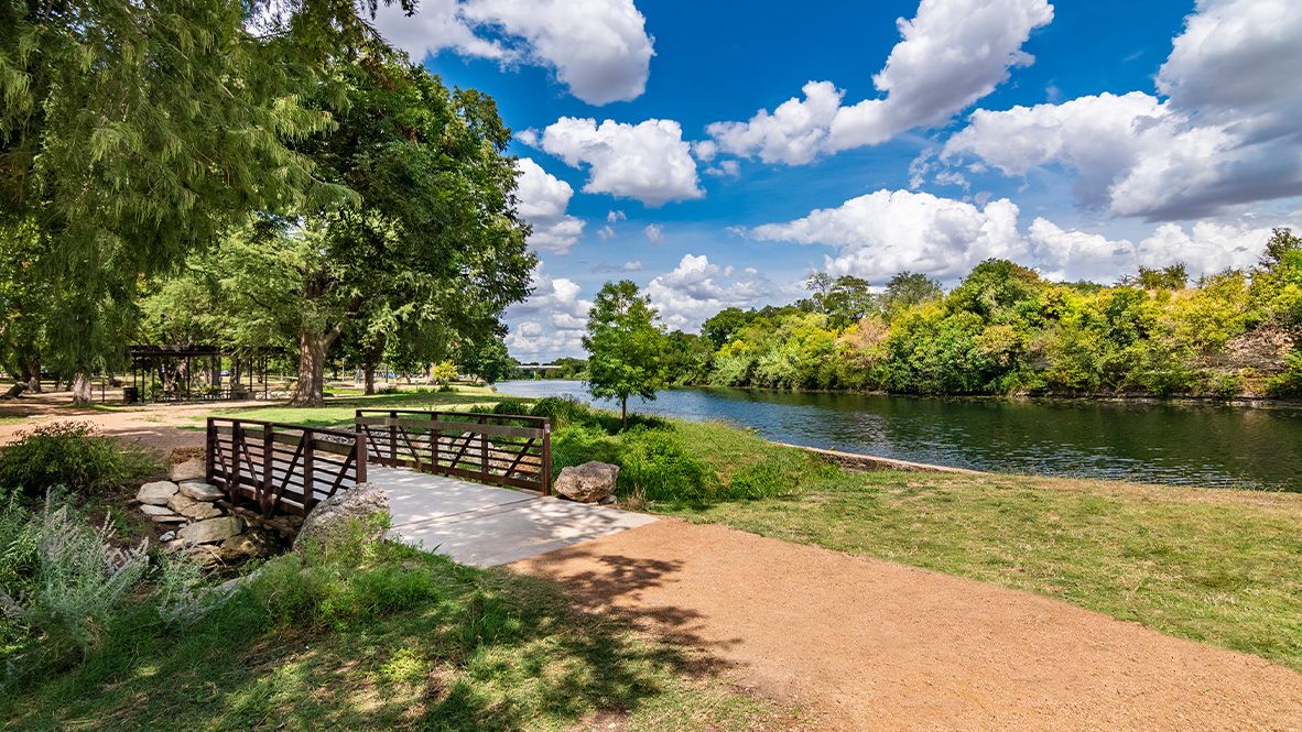 142 Rpd Spgs Cove Georgetown, TX 78628 - Photo 37 of 37 a view of a lake with a garden
