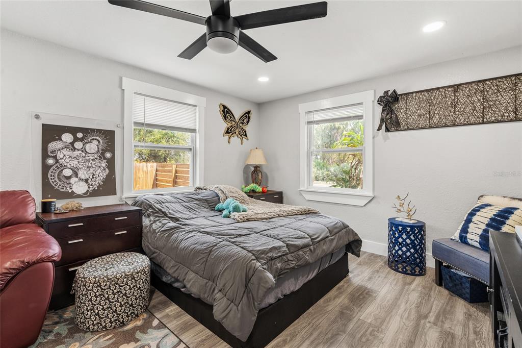 5135 Bradenton Road Sarasota, FL 34234 - Photo 15 of 30 a bedroom with a bed and wooden floor