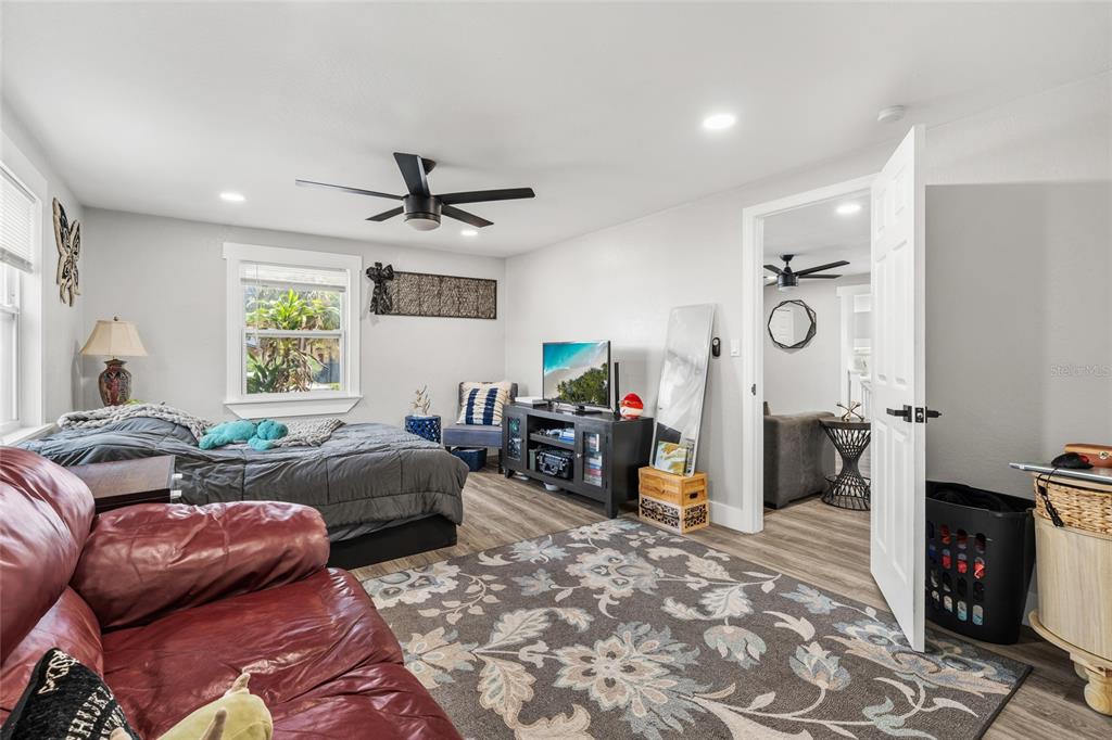5135 Bradenton Road Sarasota, FL 34234 - Photo 19 of 30 a living room with furniture a flat screen tv and a fireplace