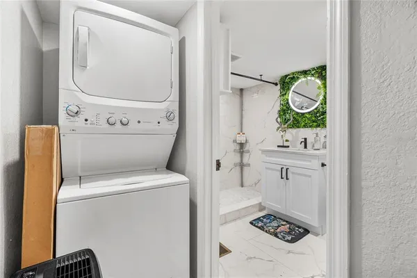 a bathroom with a sink mirror vanity and toilet