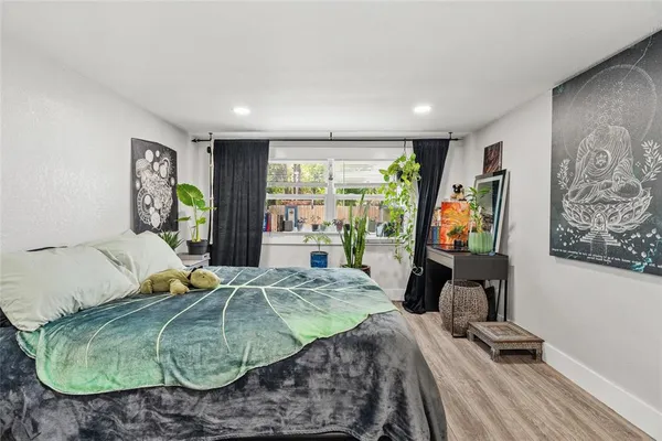 a bedroom with a bed and a table