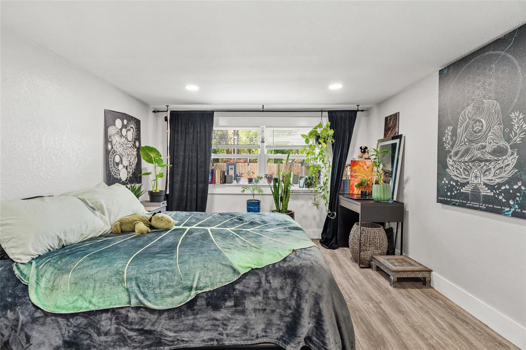 5135 Bradenton Road Sarasota, FL 34234 - Photo 23 of 30 a bedroom with a bed mirror and window