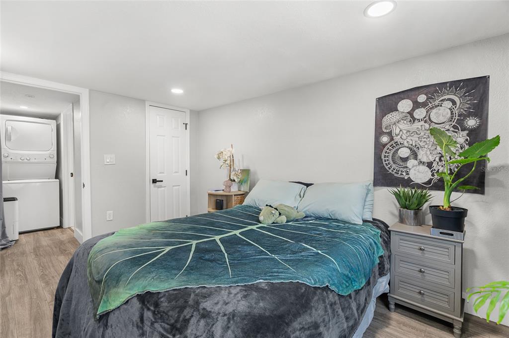 5135 Bradenton Road Sarasota, FL 34234 - Photo 25 of 30 a bedroom with a bed and a painting on the wall