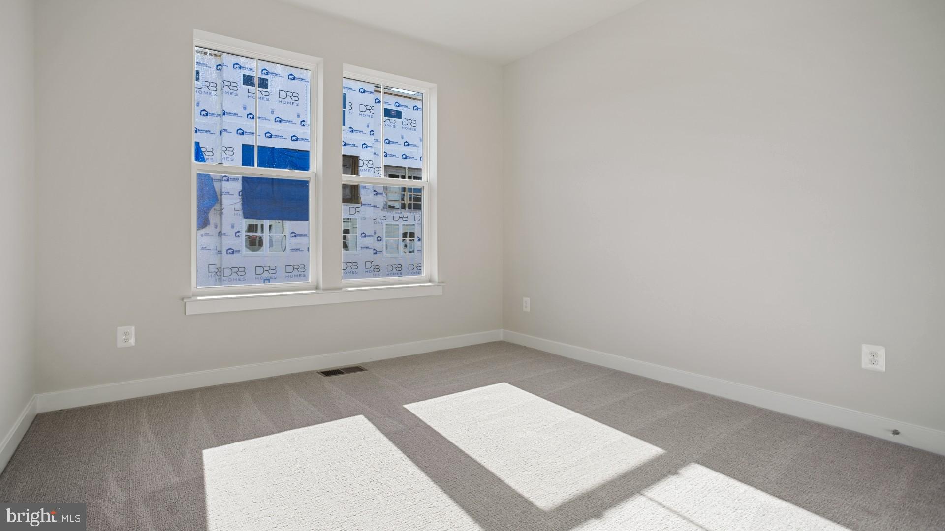 45176 Drowes Terrace Sterling, VA 20166 - Photo 10 of 15 an empty room with windows and book shelf
