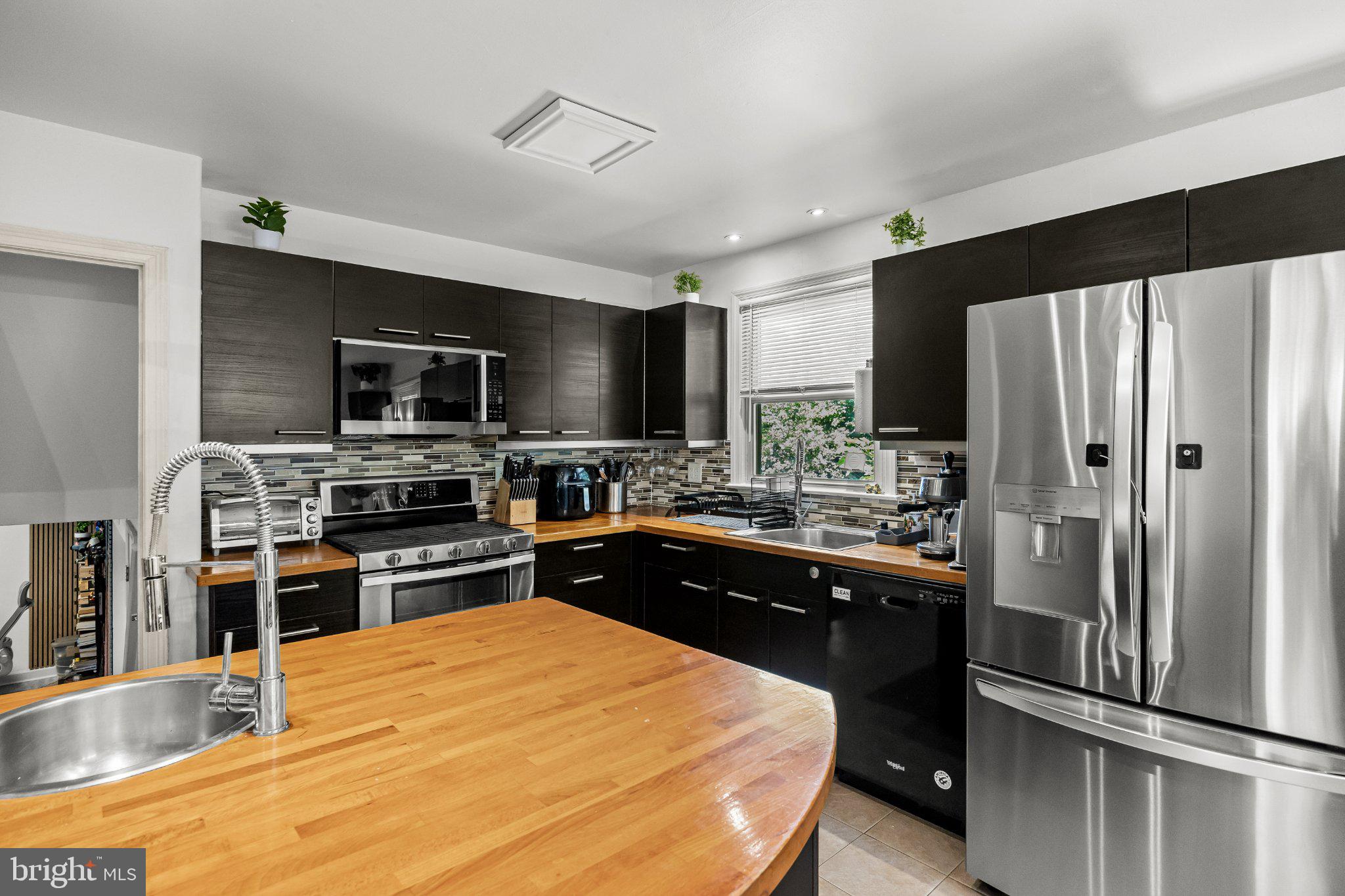 120 North Valleybrook Road Cherry Hill, NJ 08034 - Photo 11 of 27 Sleek modern kitchen with warm accents.