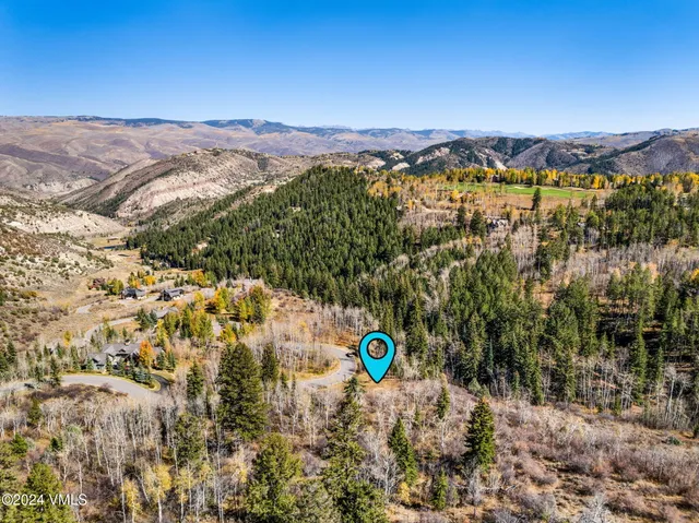 a view of a city with mountains in the background