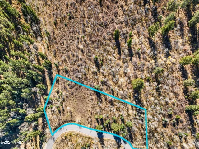 a view of a town with mountains in the background