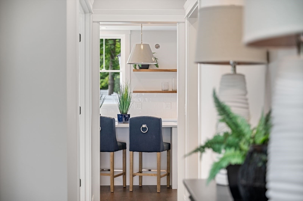 7 Milk Street Natick, MA 01760 - Photo 2 of 39 a picture of a glass door with table and chairs