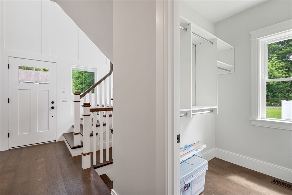 7 Milk Street Natick, MA 01760 - Photo 5 of 39 an entryway with wooden floor and windows