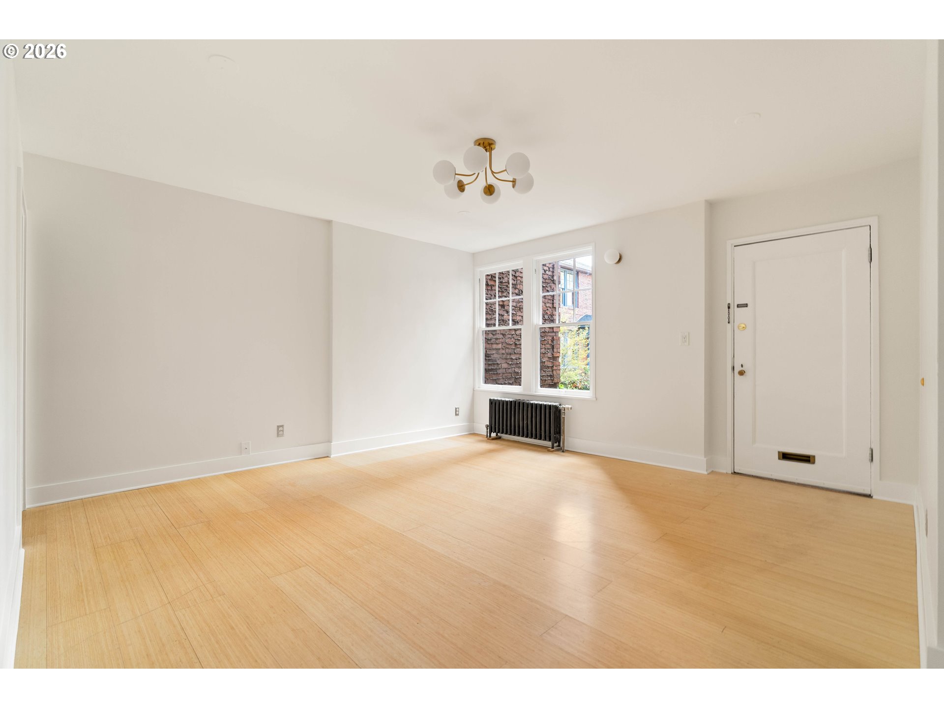 2182 Northwest Hoyt Street, Unit 8 Portland, OR 97210 - Photo 11 of 26 a view of an empty room with a window