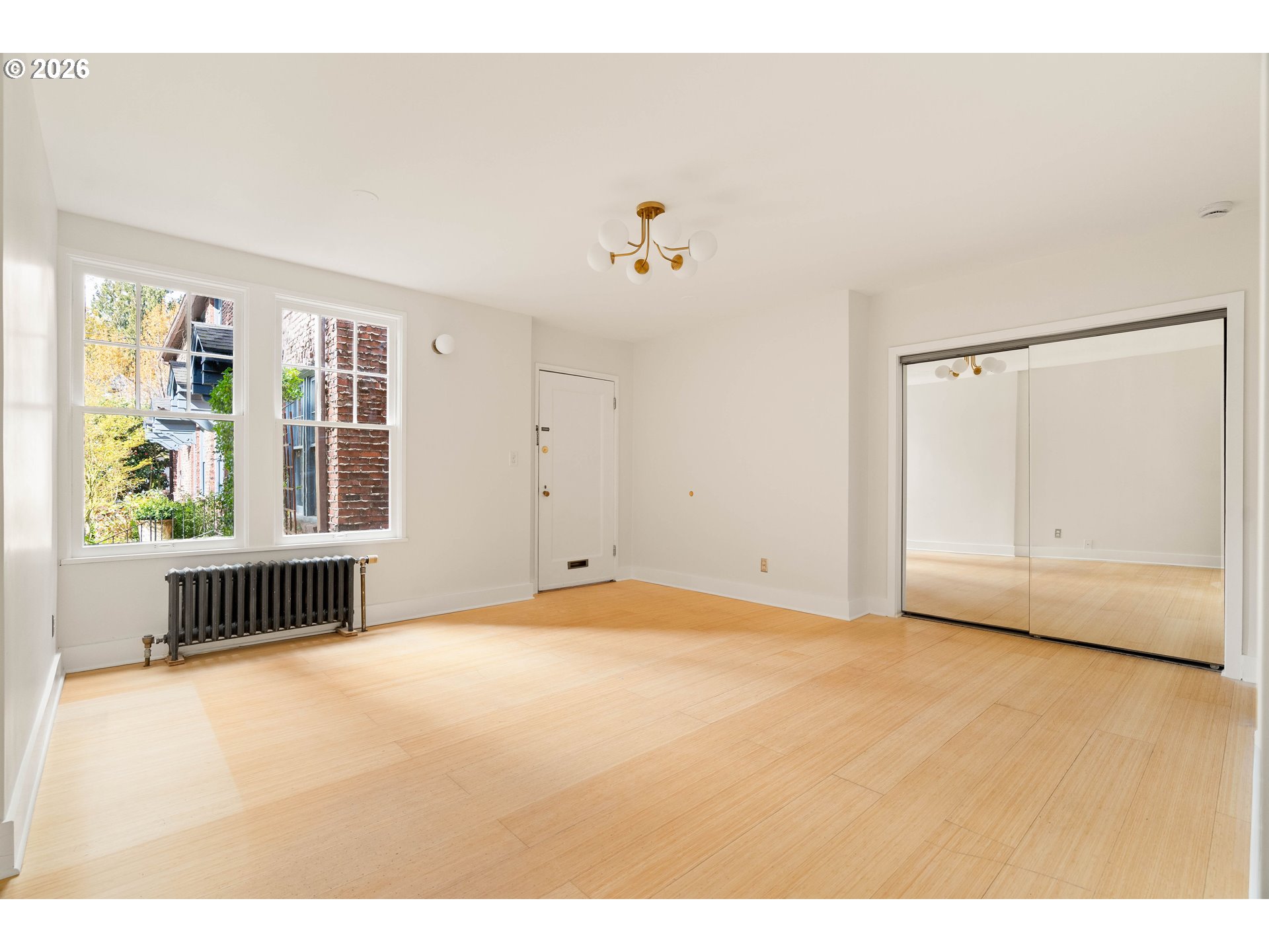 2182 Northwest Hoyt Street, Unit 8 Portland, OR 97210 - Photo 12 of 26 a view of an empty room with a window