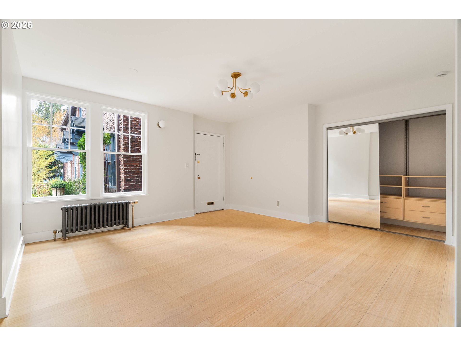 2182 Northwest Hoyt Street, Unit 8 Portland, OR 97210 - Photo 13 of 26 a view of an empty room with a window