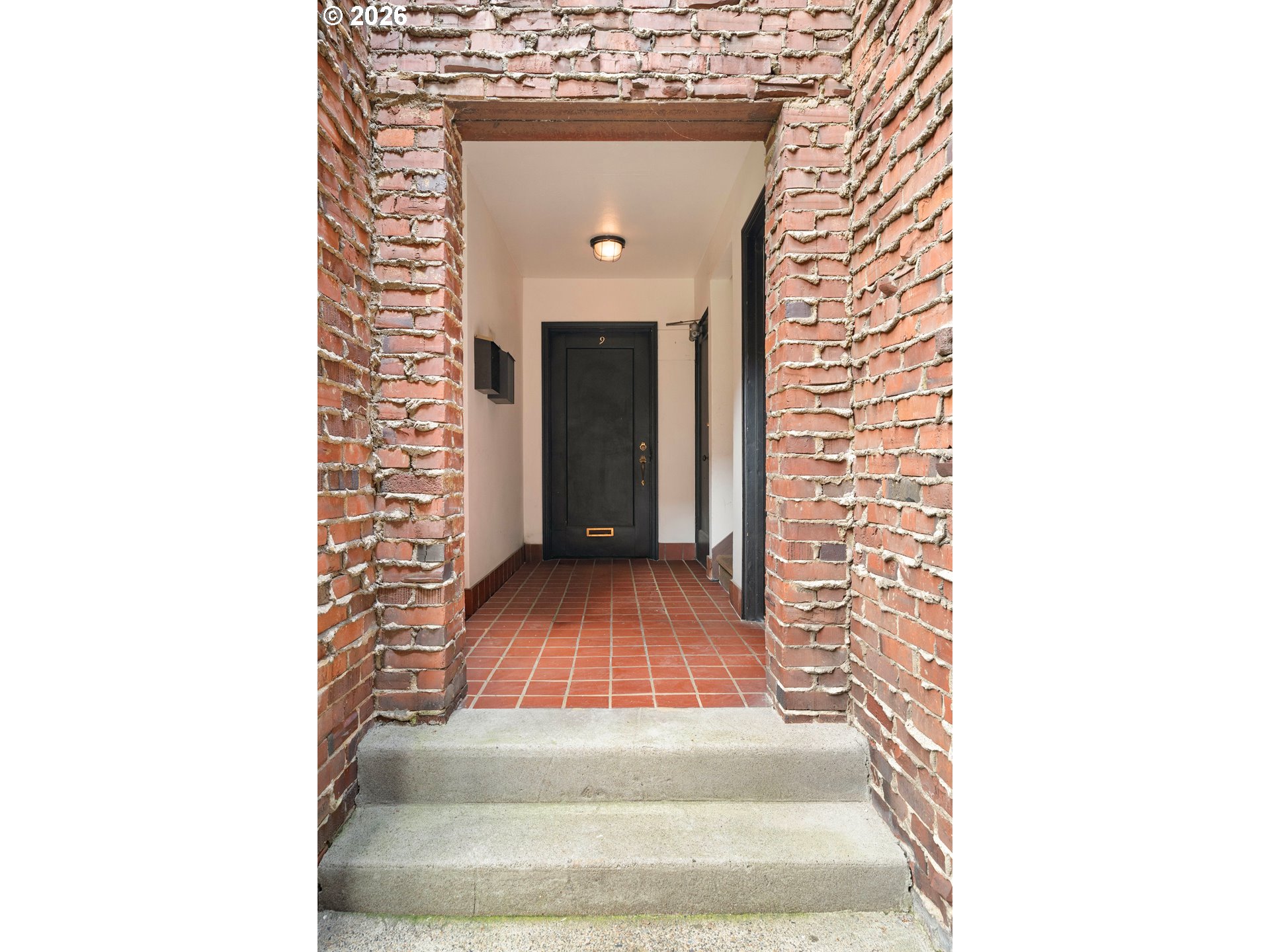 2182 Northwest Hoyt Street, Unit 8 Portland, OR 97210 - Photo 5 of 26 a view of a hallway with wooden floor