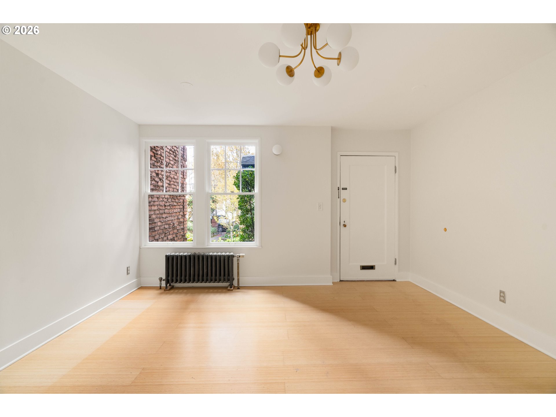 2182 Northwest Hoyt Street, Unit 8 Portland, OR 97210 - Photo 7 of 26 a view of an empty room with a window
