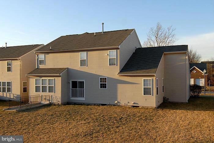 18517 Cornflower Road Boyds, MD 20841 - Photo 2 of 2 a front view of a house with a yard