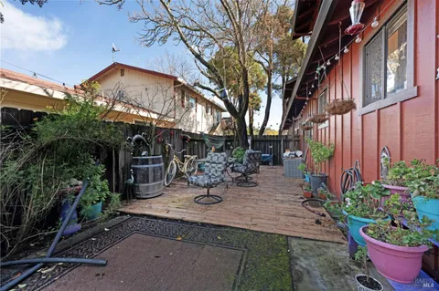 a view of a house with a yard and pathway