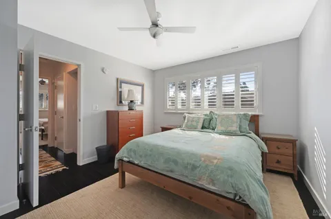 a bedroom with a bed and a dresser