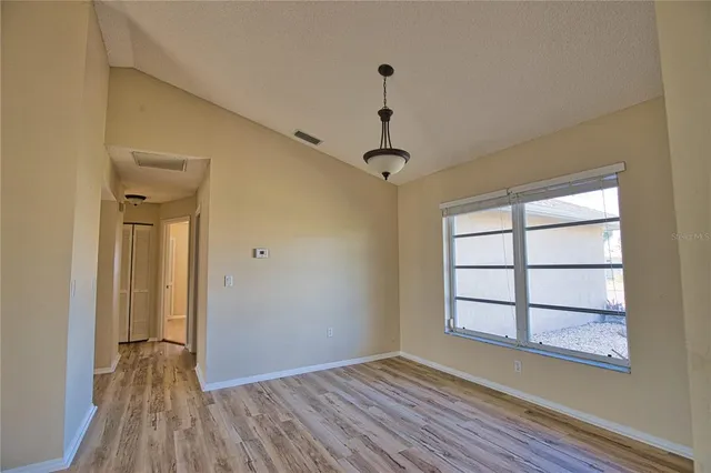 a view of room with window wooden floor and window