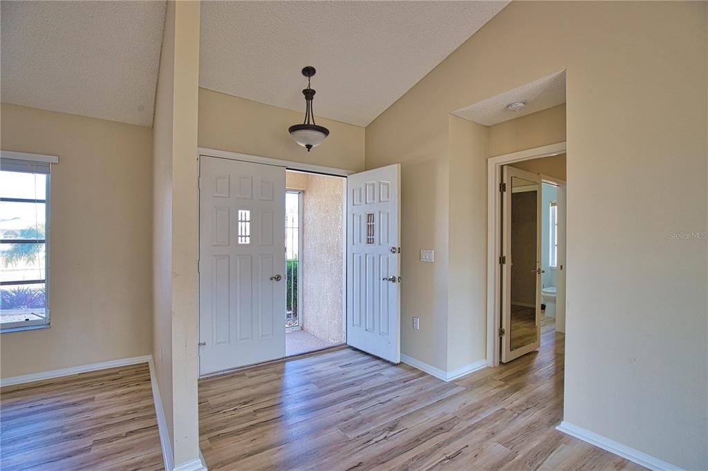 5847 Buchanan Road Venice, FL 34293 - Photo 12 of 47 a view of a hallway with wooden floor