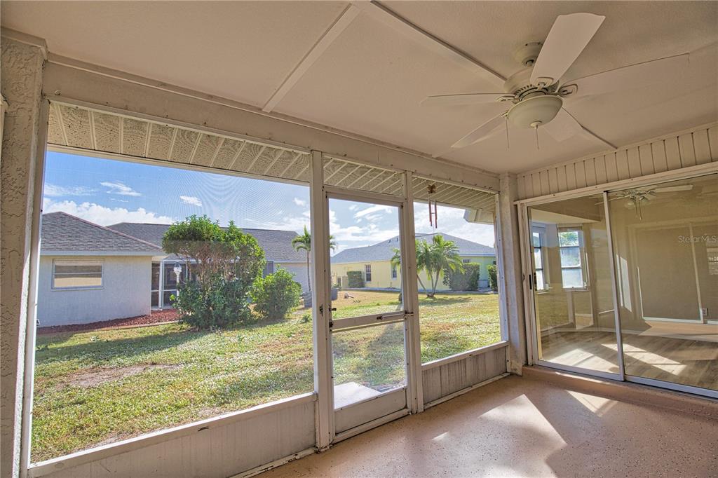 5847 Buchanan Road Venice, FL 34293 - Photo 19 of 47 a view of a porch with a floor to ceiling window