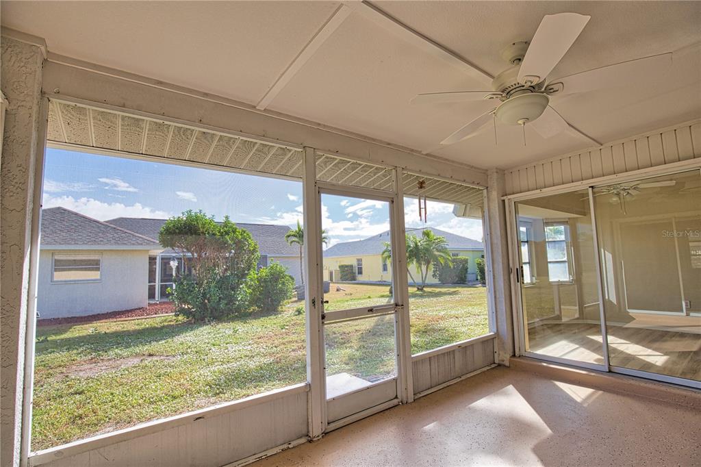 5847 Buchanan Road Venice, FL 34293 - Photo 20 of 47 a view of a porch with a floor to ceiling window