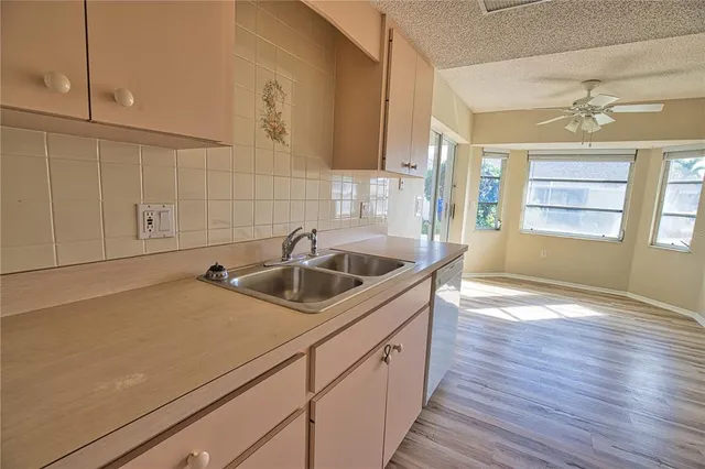 a kitchen with a sink and cabinets