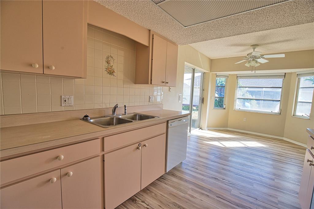 5847 Buchanan Road Venice, FL 34293 - Photo 31 of 47 a kitchen with a sink cabinets and window