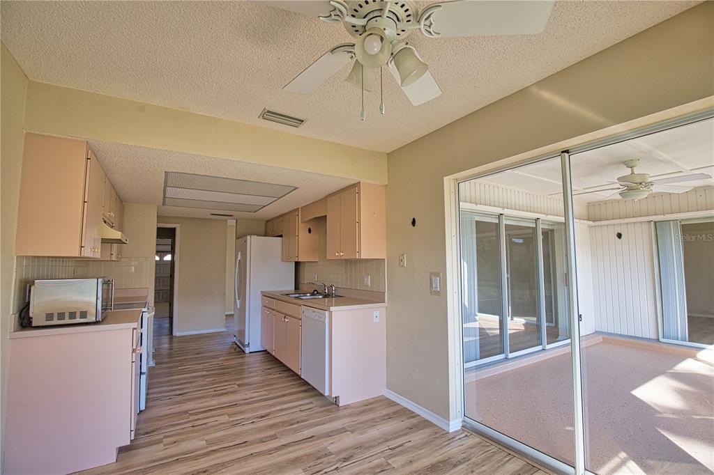5847 Buchanan Road Venice, FL 34293 - Photo 33 of 47 a view of a kitchen from the hallway