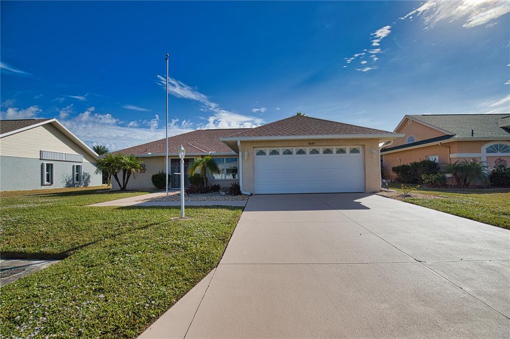 5847 Buchanan Road Venice, FL 34293 - Photo 46 of 47 a front view of a house with garden