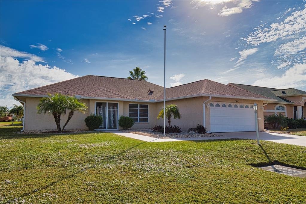 5847 Buchanan Road Venice, FL 34293 - Photo 47 of 47 a front view of a house with a yard